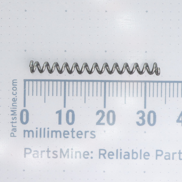 Century Spring PP-9CS spring shown next to a millimeter scale.