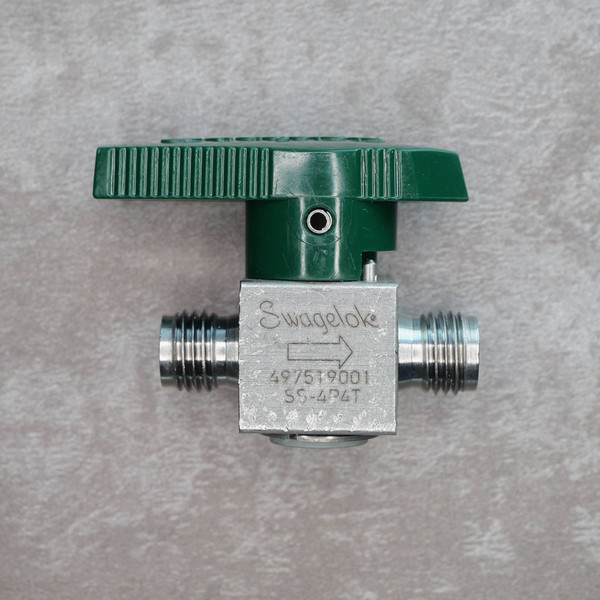 Front view of Swagelok SS-4P4T ball valve with green handle and laser-etched markings.