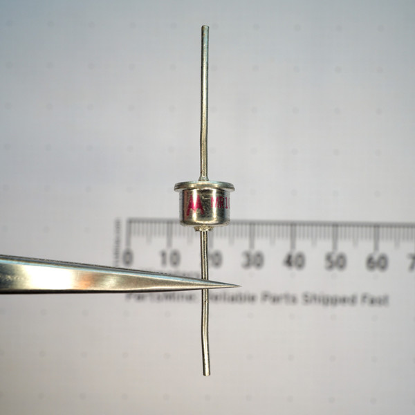 Motorola MR1031A axial diode held in tweezers against a scale.