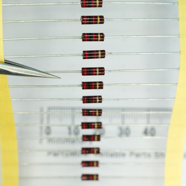 Strip of Multicomp RC1/4G202JT axial lead resistors.
