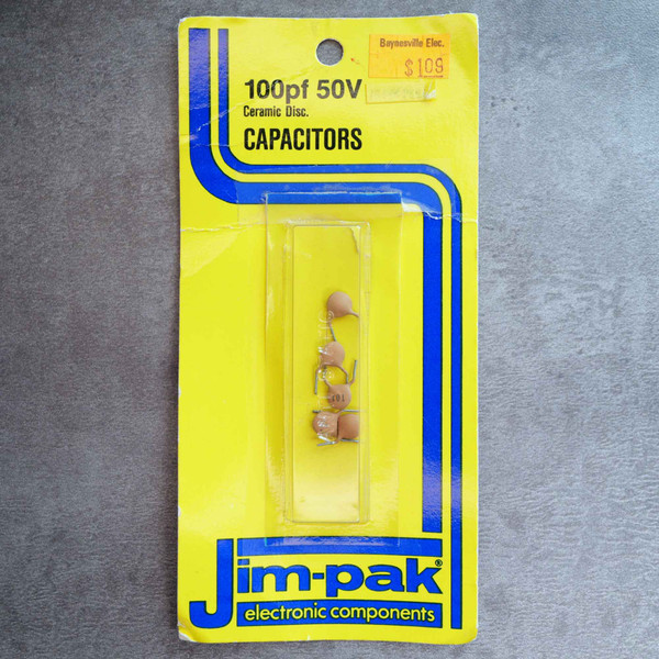 Front view of Jim-Pak blister pack card containing five 100pf 50V ceramic disc capacitors.