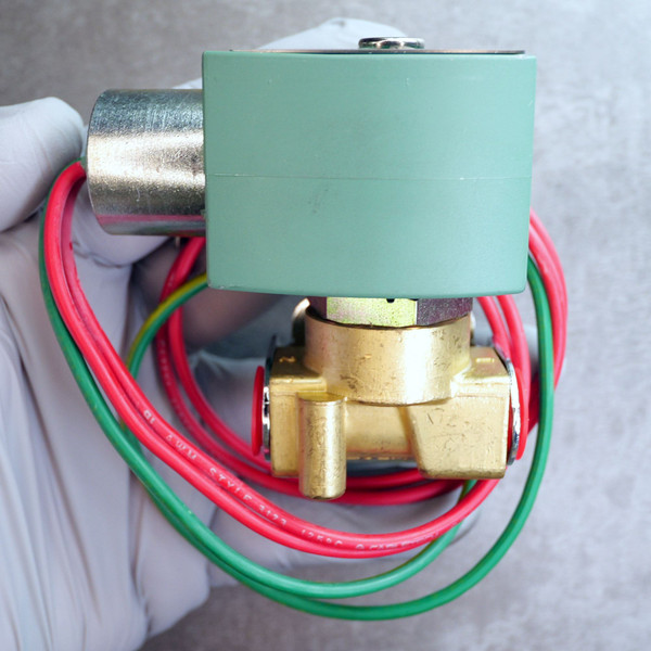 Side view of ASCO solenoid valve showing green coil, brass body, and wiring leads.