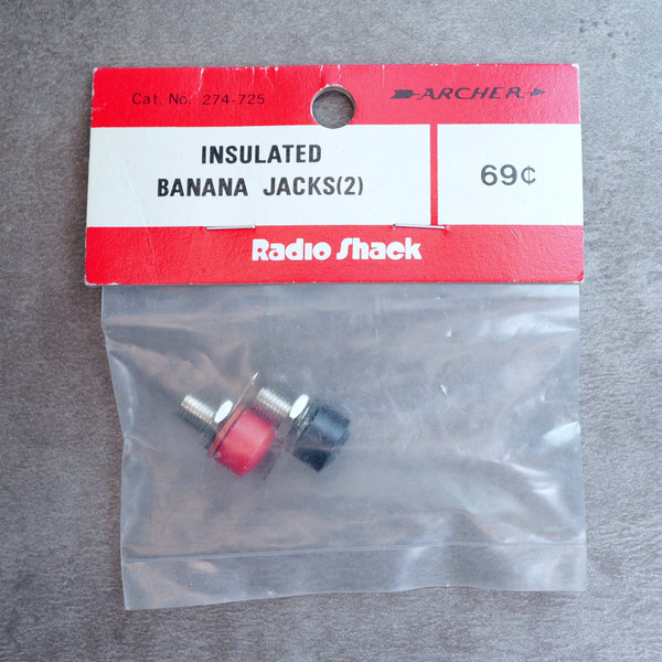 Archer Radio Shack 274-725 insulated banana jacks in original hanging packaging.