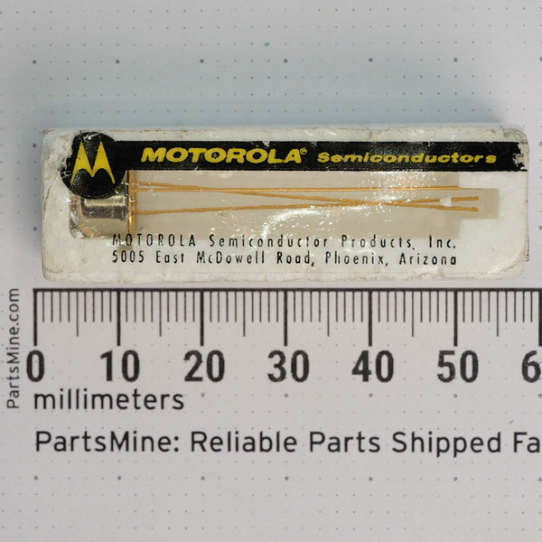 Vintage Motorola 2N1193 transistor in original sleeve alongside a millimeter ruler.