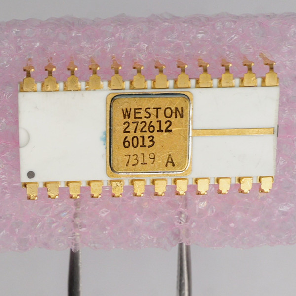 Top view of Weston 272612 white ceramic DIP IC showing part markings and gold lid.