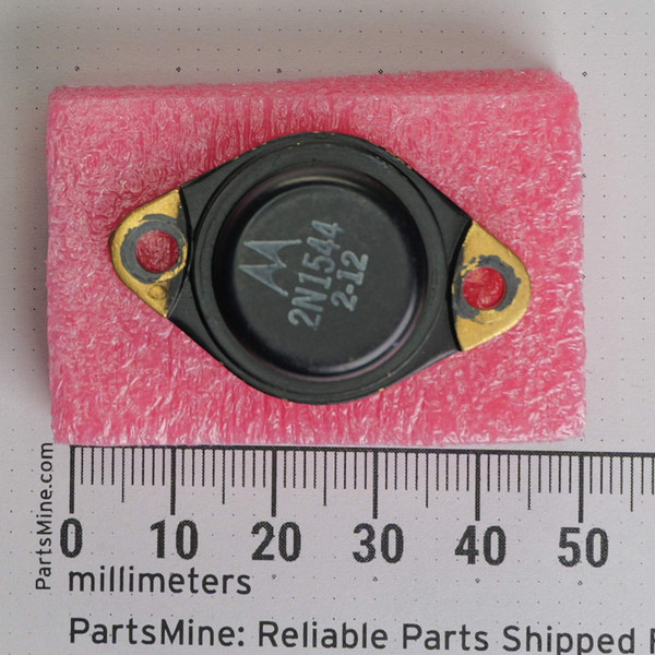 Top view of Motorola 2N1544 transistor next to millimeter ruler.