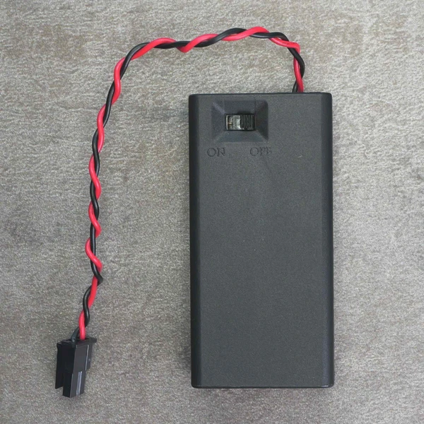 Front view of COMF SBH-321-1AS battery holder showing power switch and wire lead.