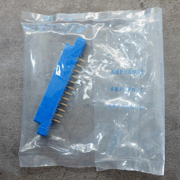 Amphenol 143-012-01 card edge connector sealed in Amphenol plastic packaging.