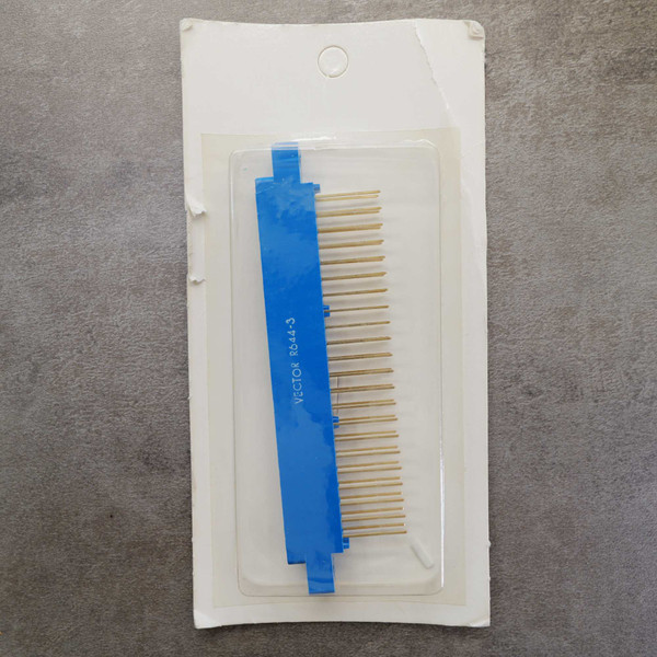 Vector R644-3 card edge connector sealed in blister packaging.