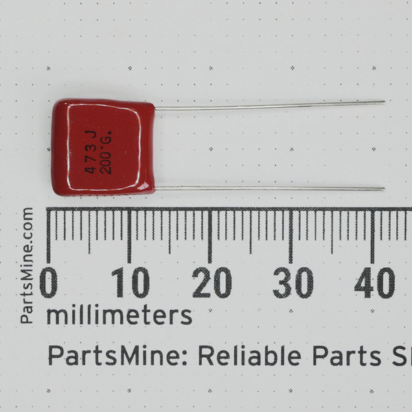 ECQ-B2473JF film capacitor face markings next to a metric ruler.