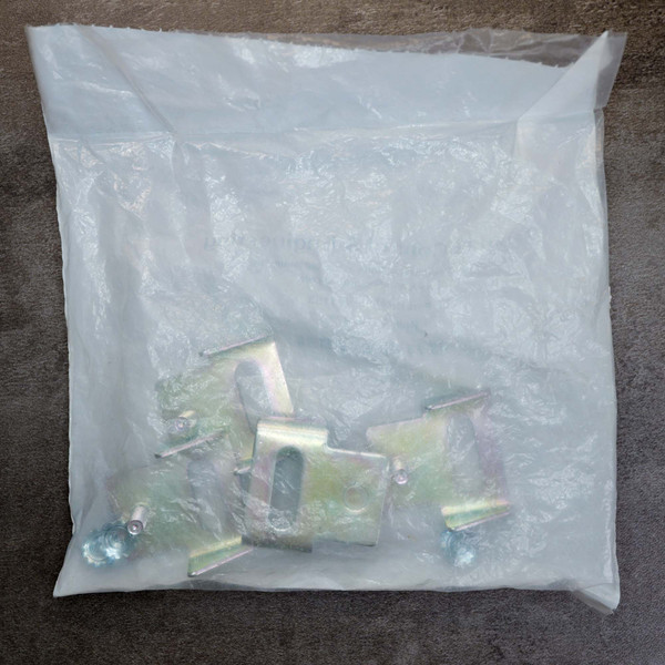 Sealed plastic bag of Saginaw 114153 mounting brackets and hardware.