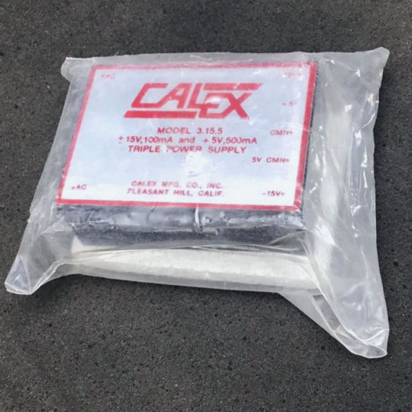 Calex 3.15.5 triple power supply module sealed in protective plastic packaging.