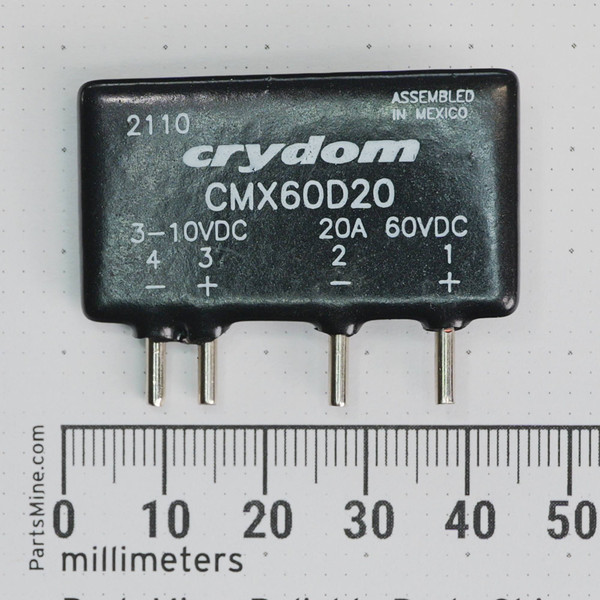 Front view of Crydom CMX60D20 solid-state relay with pin labels and markings beside a millimeter ruler.