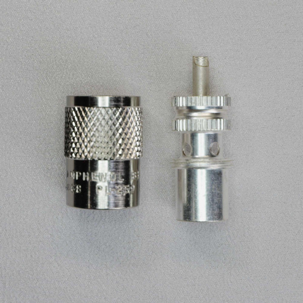 Amphenol 83-1SP PL-259 connector showing disassembled outer coupling nut and inner body.