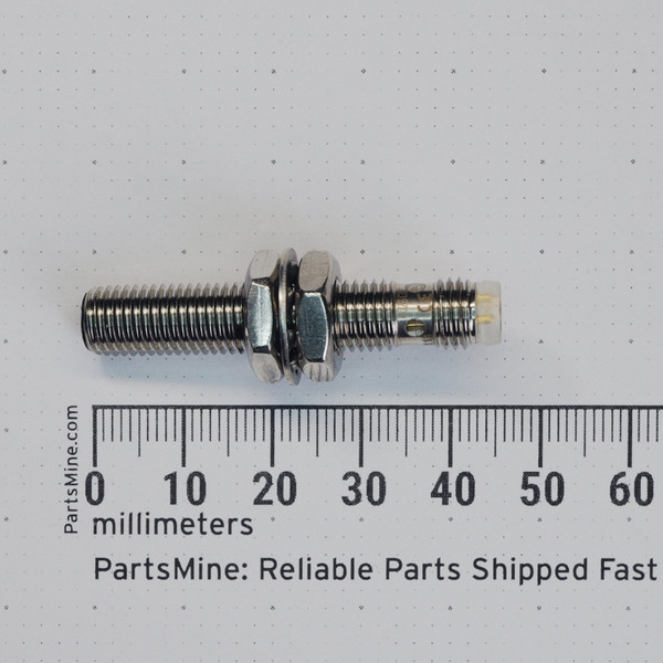Profile view with millimeter ruler of Balluff BES 00P7 inductive proximity sensor.