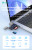 Card reader connected to laptop transferring files at high speed