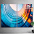 (2) vertical 48" x 72" wall-mounted SEG frames on a neutral background with a plant for scale