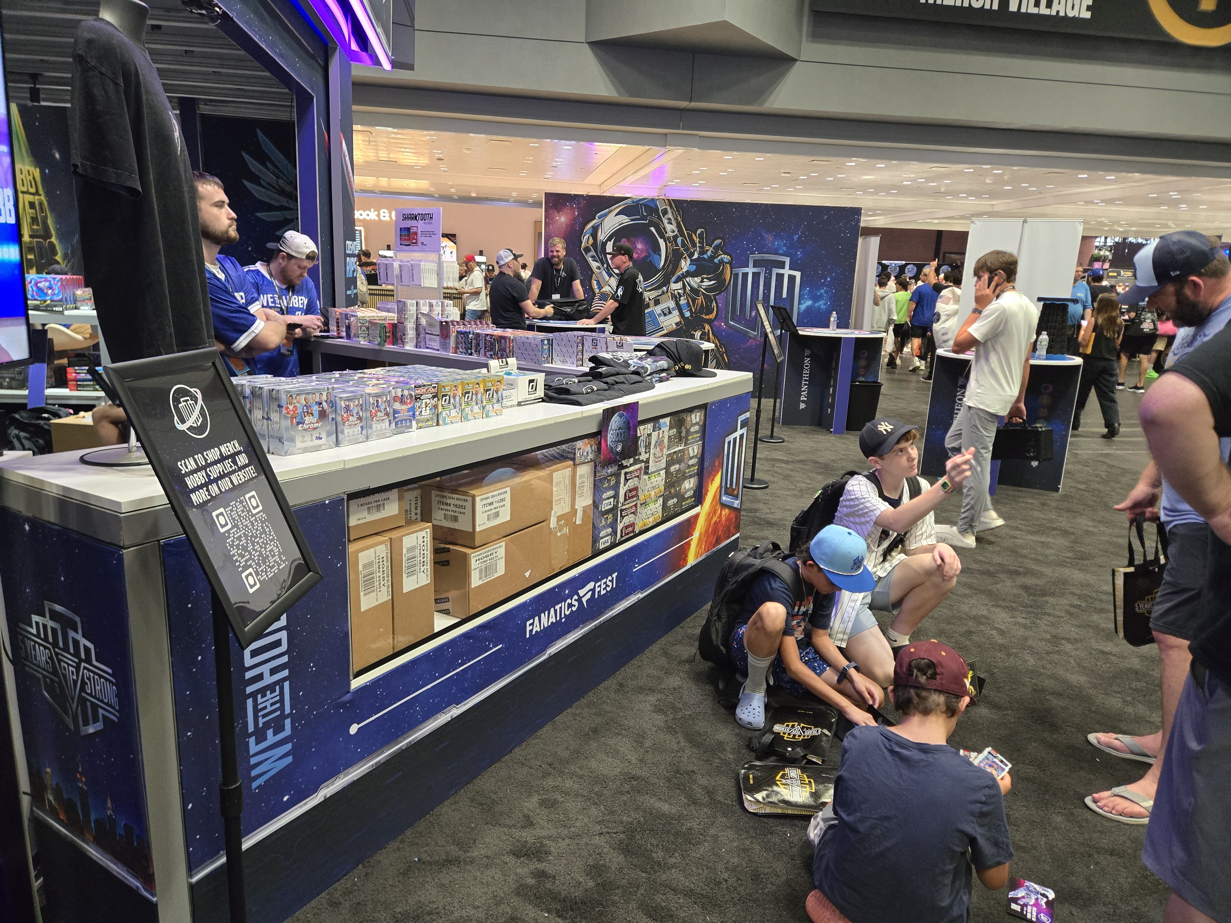 WeTheHobby trade show booth facade with edge lighting at Fanatics Fest