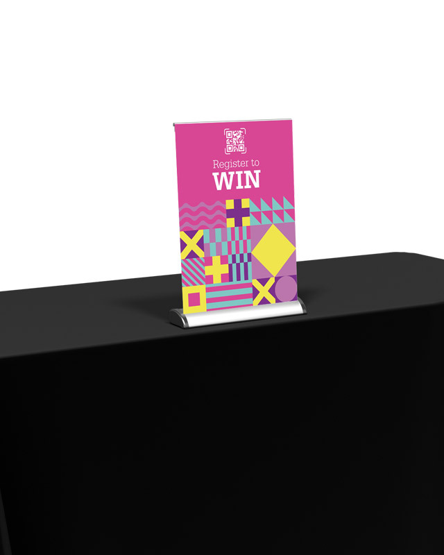 Tabletop retractable banner stand with custom printed graphic