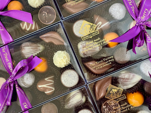 Handmade chocolates displayed in a gift box, including filled chocolates, solid chocolates, chocolate clusters, dipped Turkish delight and caramels, created during The Treat Factory's DIY Chocolate Box Workshop in Berry NSW.
Experience