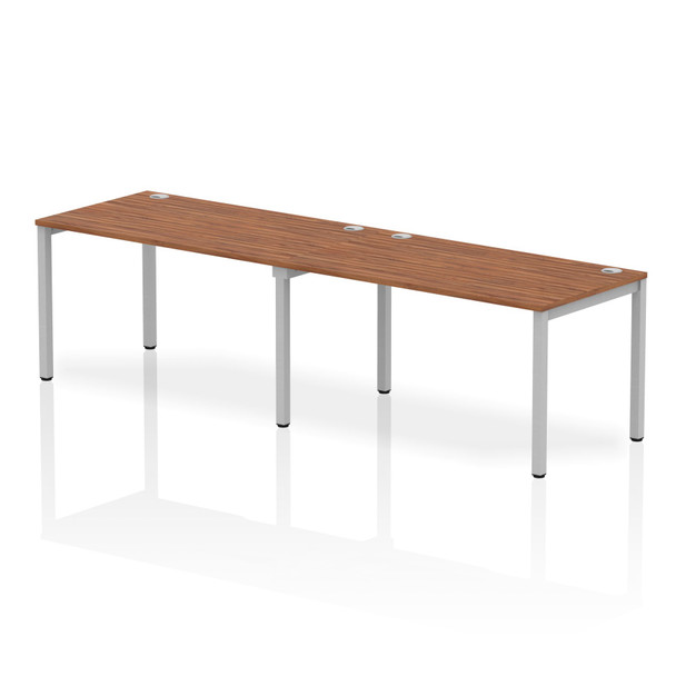 Impulse Single Row 2 Person Bench Desk W1400 X D800 X H730mm Walnut Finish Silve IB00296 Impulse Single Row 2 Person Bench Desk W1400 X D800 X H730mm Walnut Finish Silve IB00296