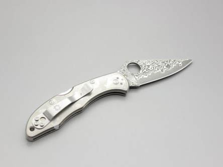 Spyderco Knives: Delica 4 VG-10 Damascus Steel (Full Flat Grind), Folding Pocket Knife w/ Matte Finish Titanium Handle Spyderco Knives: Delica 4 VG-10 Damascus Steel (Full Flat Grind), Folding Pocket Knife w/ Matte Finish Titanium Handle