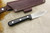 LT Wright Knives Genesis - Black Canvas Micarta - AEB-L Stainless Steel - Scandi Grind - Toxic Green Liners - Silver Corby Bolts