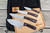 LT Wright Knives Cookcraft Collection Four Piece Knife Set w/ Bag and Board - AEB-L Steel - Flat Grind - Double Red Canvas Micarta w/ White Liners - Polished Finish
