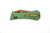 Aux Mfg - Pocket Tanto CB - 2.75" Rose Gold PVD 14c28n Steel Folding Blade w/ Green Milled Aluminum Handles