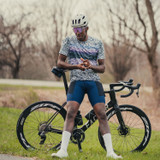 All Day Cargo Cycling Shirt - Static - On Model standing next to bike