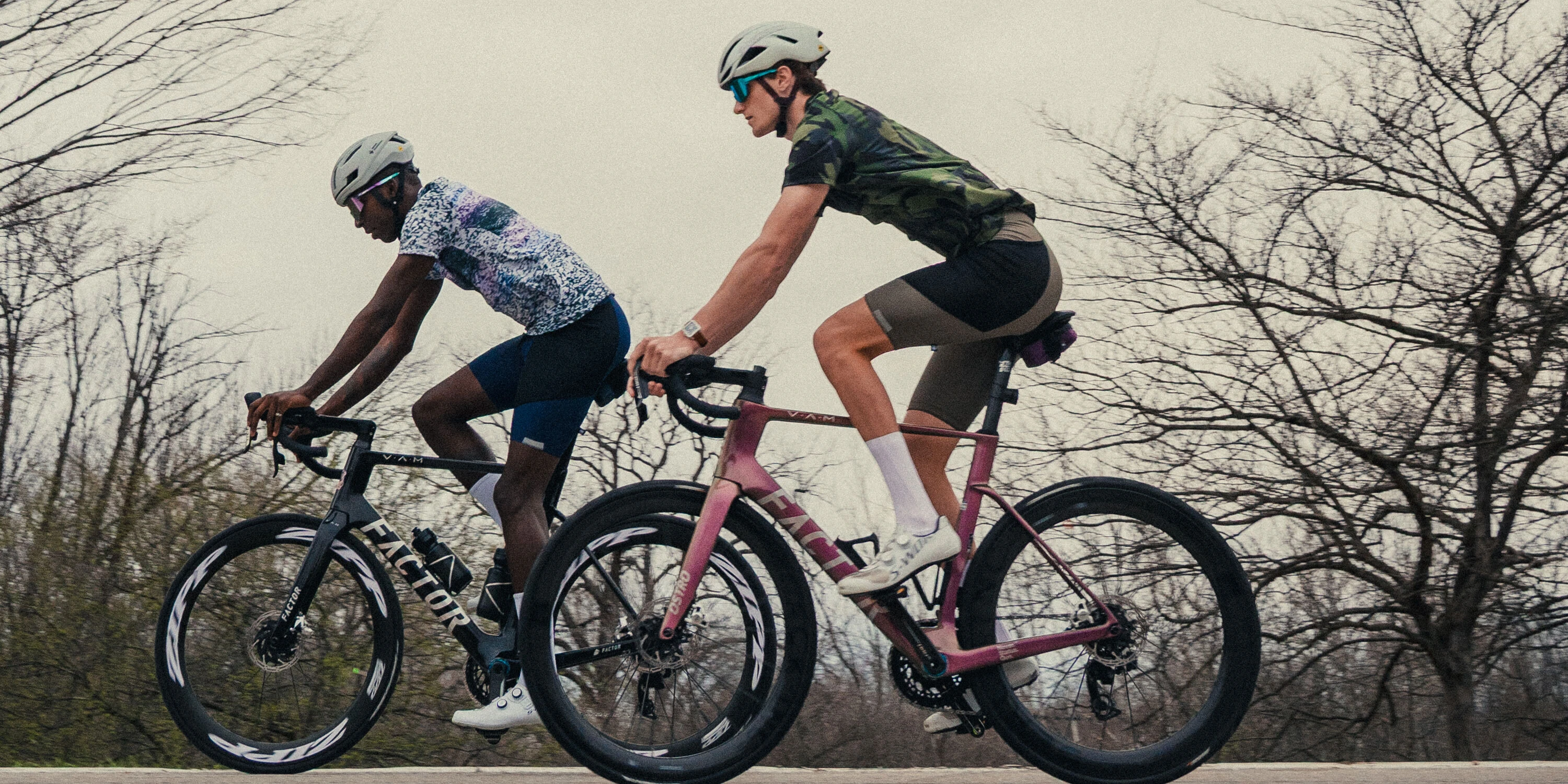 two cyclists riding in the new matte color gel touring shorts