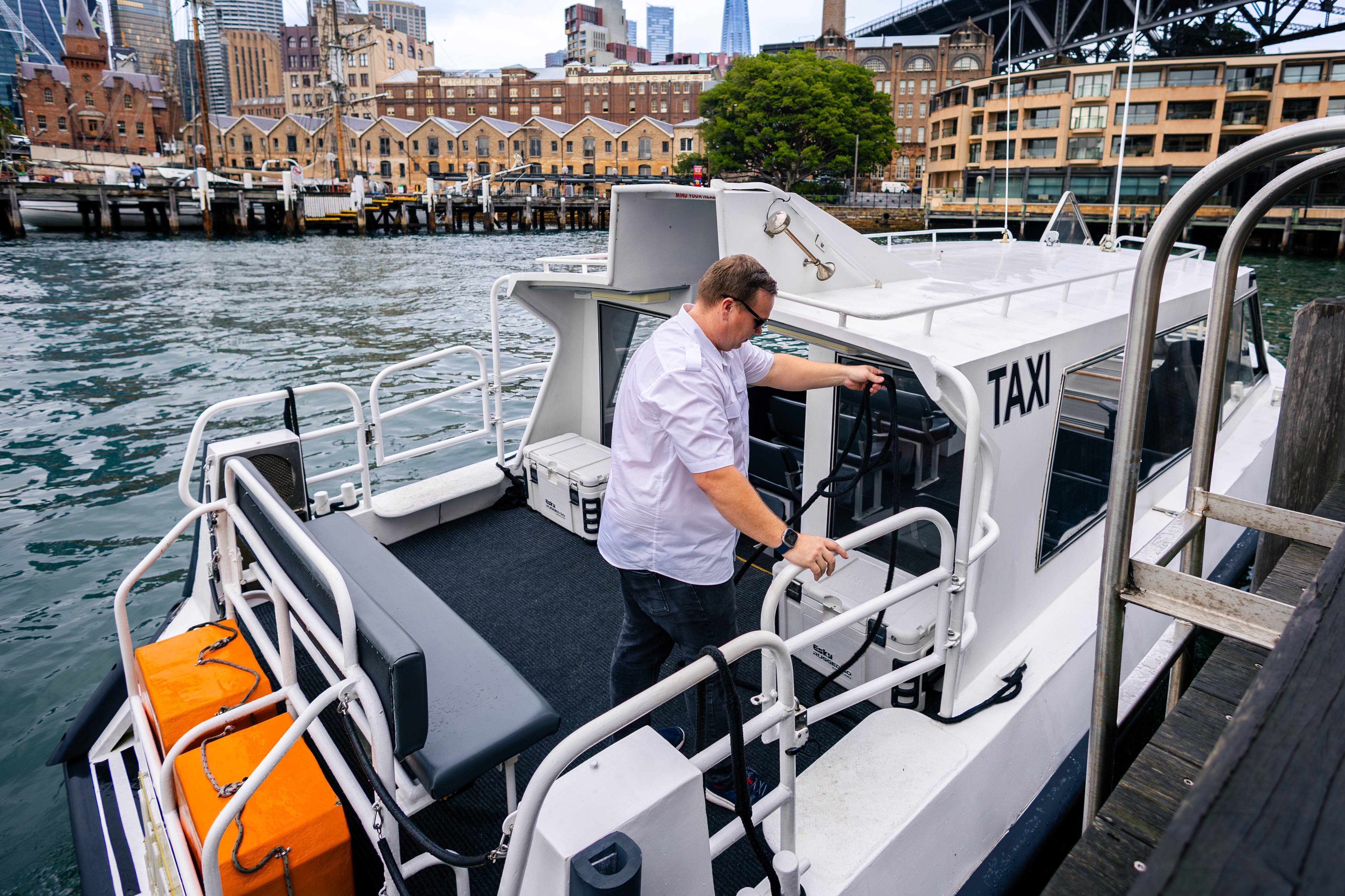 A white water taxi boat ready to load passengers.