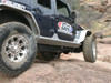 GenRight 4 Door Jeep JK Rocker Guards on a blue Rubicon