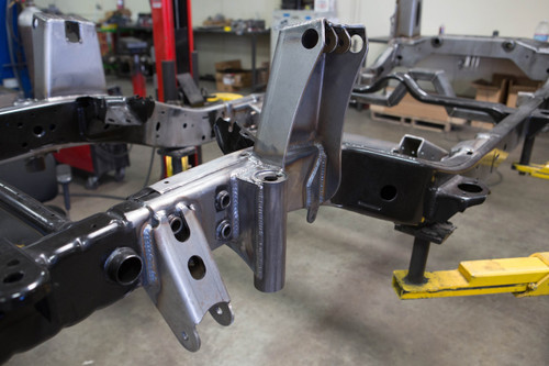Here you can see the front bump can welded in place next to the shock tower Here you can see the front bump can welded in place next to the shock tower