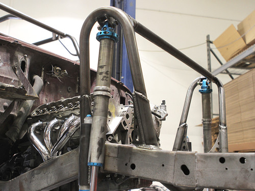 Here is a set of hoops being tacked into place on a Jeep frame Here is a set of hoops being tacked into place on a Jeep frame