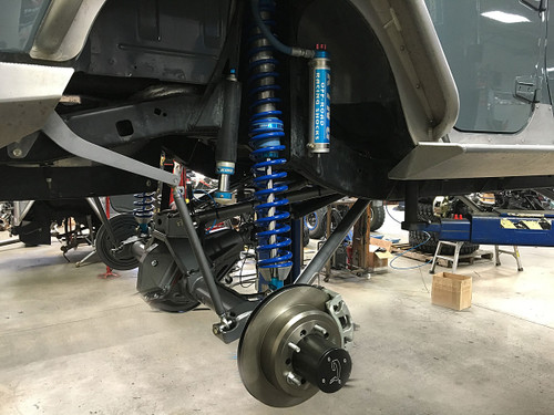 A side view of how the shock mounts to the axle. A side view of how the shock mounts to the axle.