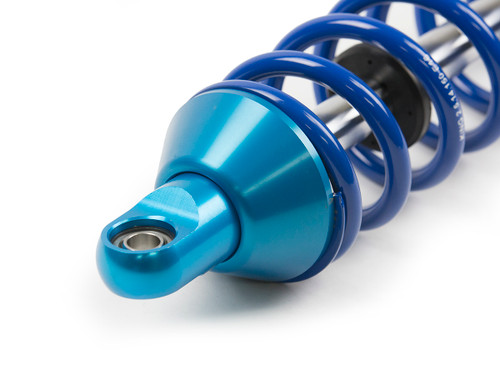 Tapered spring cup provides more room during articulation. Tapered spring cup provides more room during articulation.