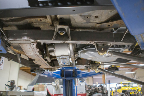 Side view of the GenRight cross member holding trans and t-case in a Jeep build. Side view of the GenRight cross member holding trans and t-case in a Jeep build.