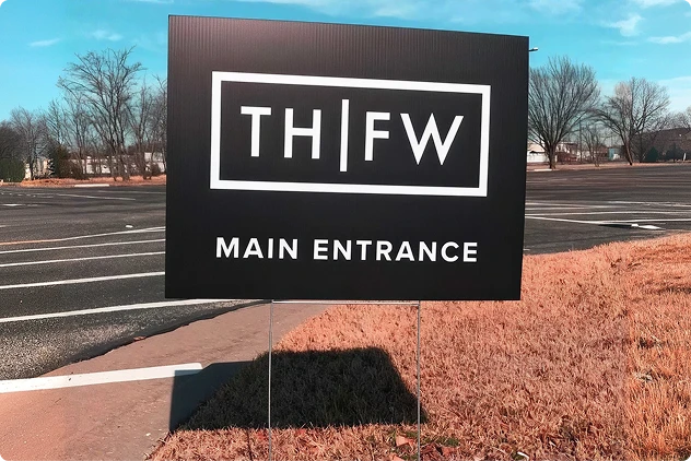 Coro yard sign displaying a main entrance message