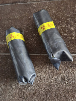showing how 25 Grams of Autunite Fragmentsships wrapped in lead