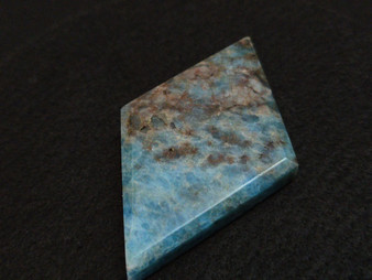 carved and polished Blue Apatite Crystal  under indoor light