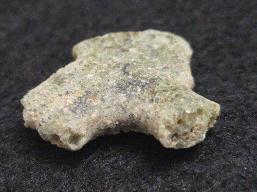 1.1 Gram Trinitite sample displayed under indoor light