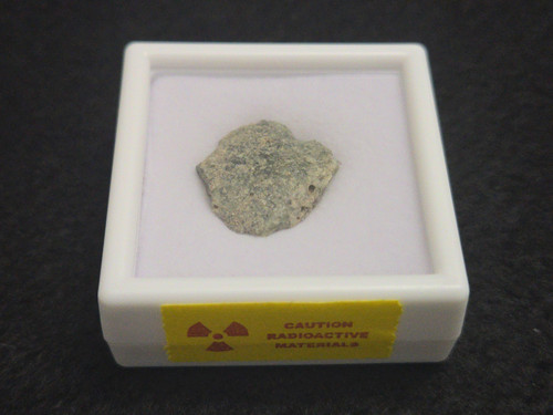 showing how the specimen is stored in a labeled display case and radioactive warning tape - top view