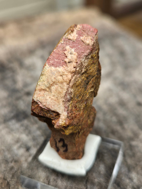drab reddish brown Monazite -(Ce) Crystal twin on displayed under outdoor light