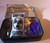 showing how product is shipped in a labeled metal tin with a single free UV light source