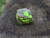 Autunite on Matrix Mini-Cabinet Specimen on display under outdoor light