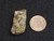 Autunite on Matrix Mini-Cabinet Specimen under indoor light size comparison to copper penny bottom view