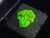 1.6 gram  Autunite Crystal in Perky Box in display under 365nm UV light