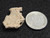 1.5 gram Trinitite specimen on display under indoor light size comparison to steel penny bottom view