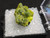 3.6 Gram Autunite Crystal in Perky Box  under indoor light